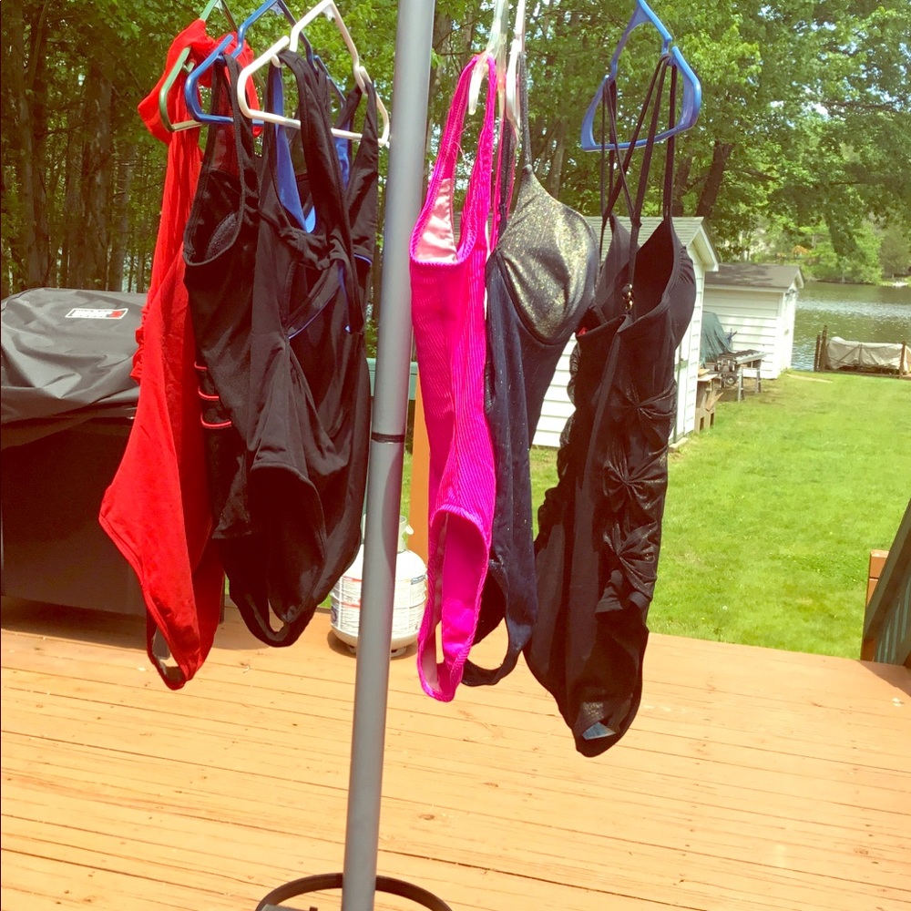 6 One piece bathing suits in various sizes.